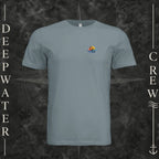 Blue Storm Deepwater Crew Co. Be Salty, Stay Lit crewneck T-shirt, front view with small cross, sunset, and blue-wave crest.