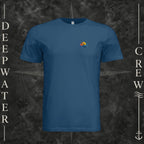 Cool Blue Deepwater Crew Co. Be Salty, Stay Lit crewneck T-shirt, front view with small cross, sunset, and blue-wave crest.