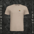 Dust Deepwater Crew Co. Be Salty, Stay Lit crewneck T-shirt, front view with small cross, sunset, and blue-wave crest.