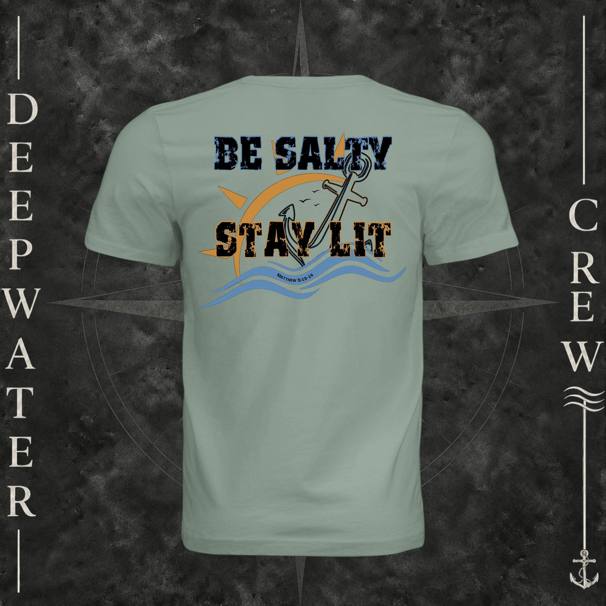Sage Deepwater Crew Co. Be Salty, Stay Lit crewneck T-shirt, back view with distressed Be Salty, Stay Lit lettering, anchor, sun, blue waves, and Matthew 5:13–14.
