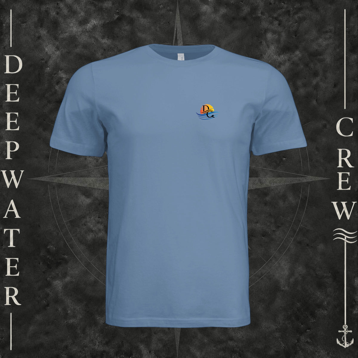 Slate Deepwater Crew Co. Be Salty, Stay Lit crewneck T-shirt, front view with small cross, sunset, and blue-wave crest.