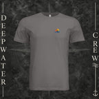 Storm Deepwater Crew Co. Be Salty, Stay Lit crewneck T-shirt, front view with small cross, sunset, and blue-wave crest.
