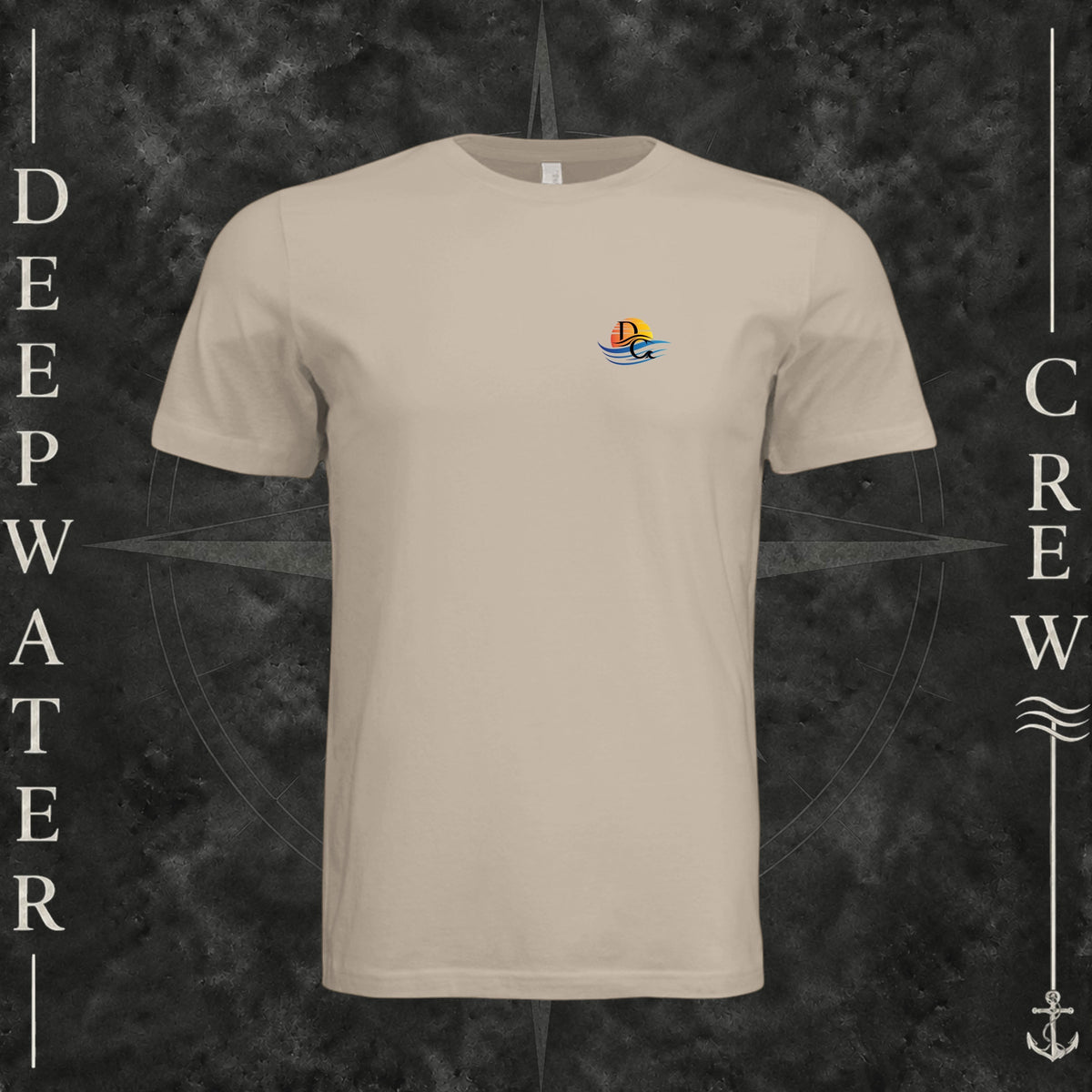 Tan Deepwater Crew Co. Be Salty, Stay Lit crewneck T-shirt, front view with small cross, sunset, and blue-wave crest.