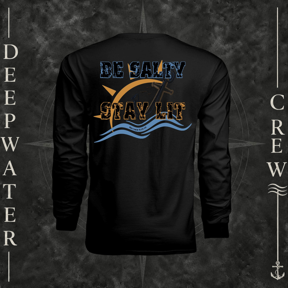 Black Deepwater Crew Co. Be Salty, Stay Lit UPF 44+ long-sleeve performance shirt, back view with distressed Be Salty, Stay Lit lettering, anchor, sun, blue waves, subtle cross, and Matthew 5:13–14.