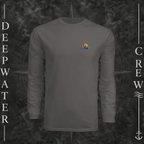 Graphite Deepwater Crew Co. Be Salty, Stay Lit UPF 44+ long-sleeve performance shirt, front view with small cross, sunset, and blue-wave crest with DC logo.