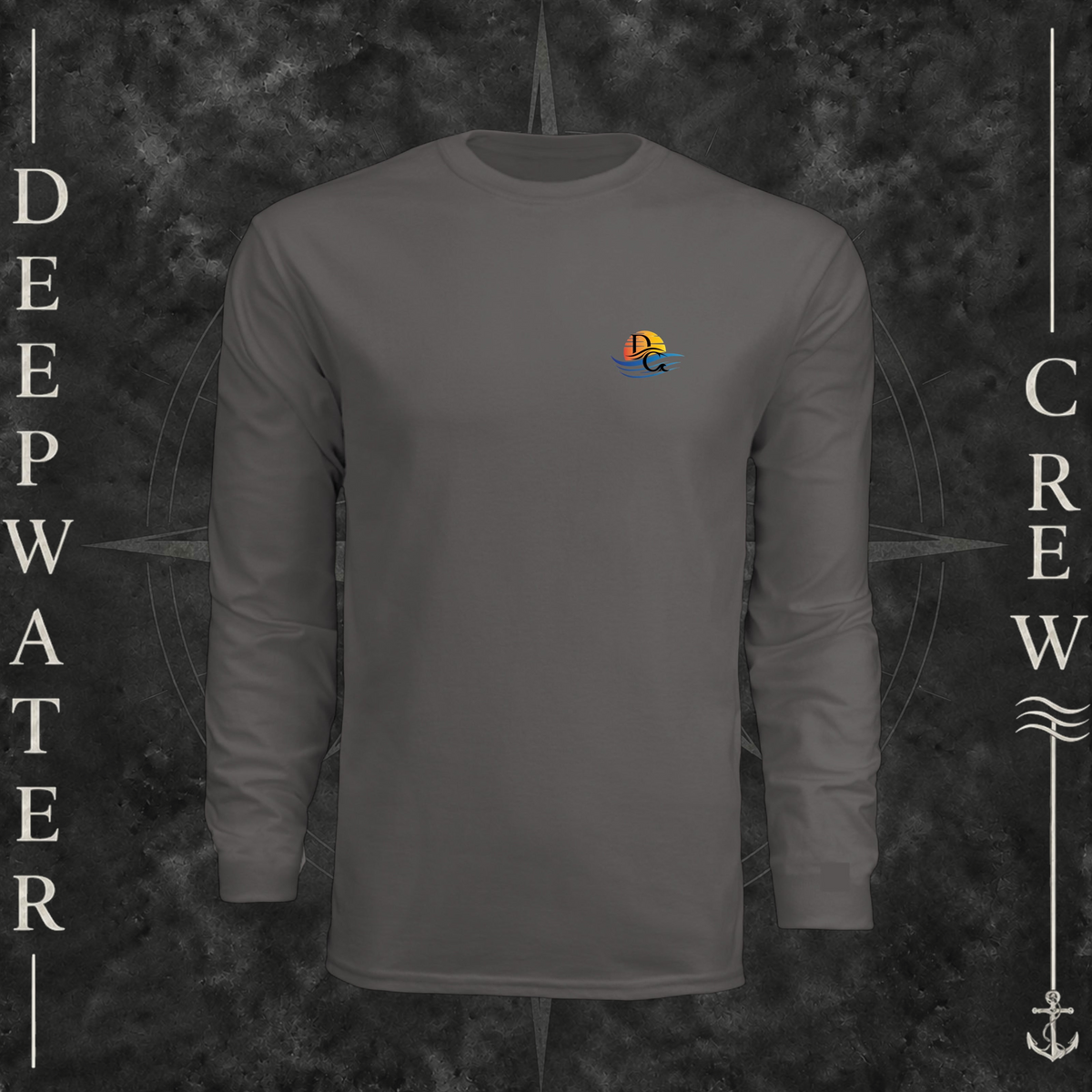 Graphite Deepwater Crew Co. Be Salty, Stay Lit UPF 44+ long-sleeve performance shirt, front view with small cross, sunset, and blue-wave crest with DC logo.
