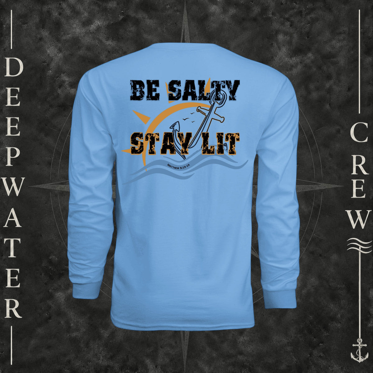 Light Blue Deepwater Crew Co. Be Salty, Stay Lit UPF 44+ long-sleeve performance shirt, back view with distressed Be Salty, Stay Lit lettering, anchor, sun, blue waves, subtle cross, and Matthew 5:13–14.