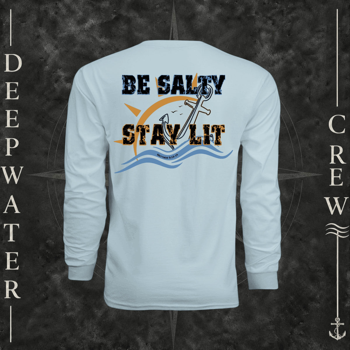 Pastel Blue Deepwater Crew Co. Be Salty, Stay Lit UPF 44+ long-sleeve performance shirt, back view with distressed Be Salty, Stay Lit lettering, anchor, sun, blue waves, subtle cross, and Matthew 5:13–14.