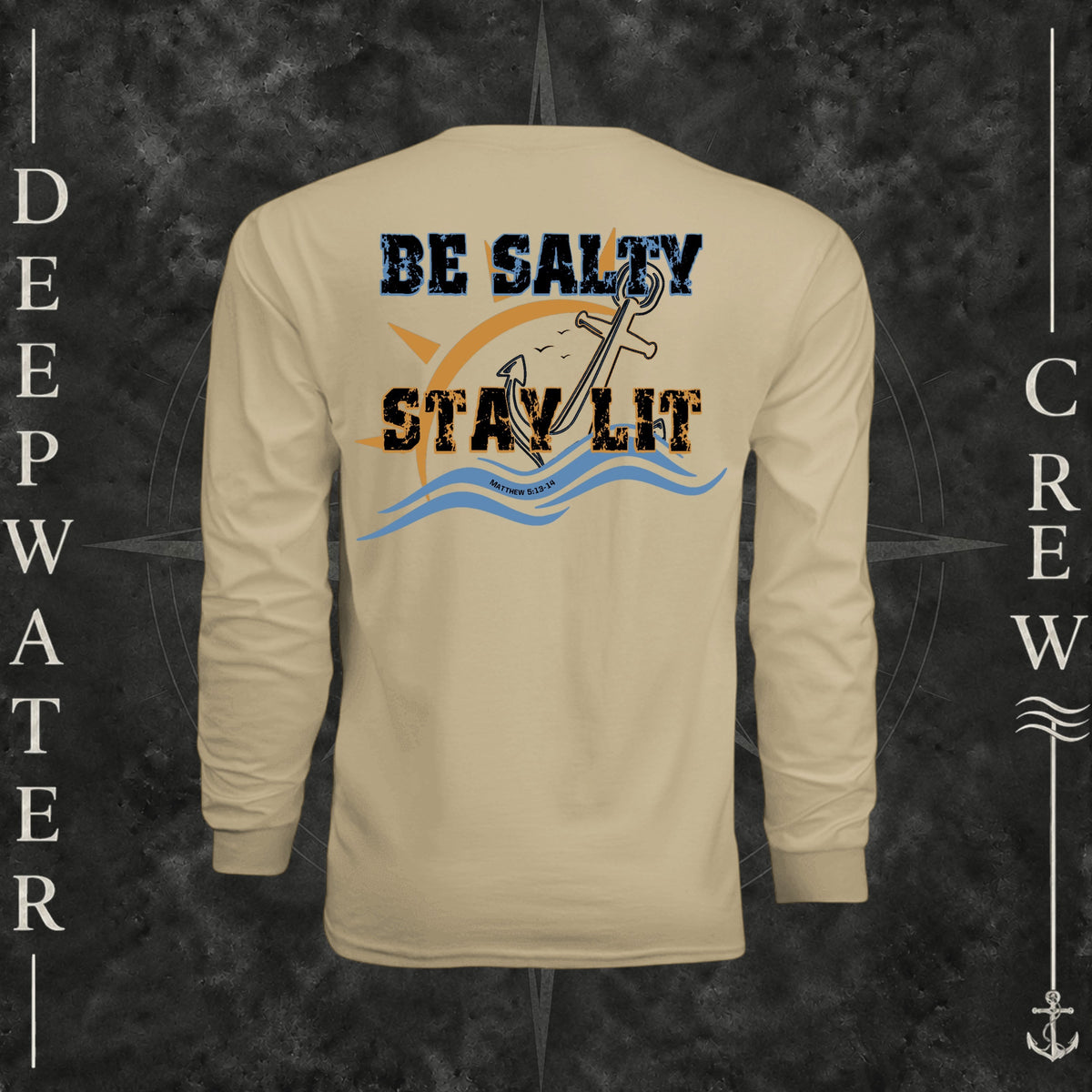 Sand Deepwater Crew Co. Be Salty, Stay Lit UPF 44+ long-sleeve performance shirt, back view with distressed Be Salty, Stay Lit lettering, anchor, sun, blue waves, subtle cross, and Matthew 5:13–14.