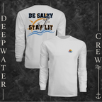 Silver Deepwater Crew Co. Be Salty, Stay Lit UPF 44+ long-sleeve performance shirt showing front and back views with cross, sunset, and wave chest crest with DC logo and Matthew 5:13–14 anchor-and-wave back graphic.