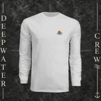 Silver Deepwater Crew Co. Be Salty, Stay Lit UPF 44+ long-sleeve performance shirt, front view with small cross, sunset, and blue-wave crest with DC logo.