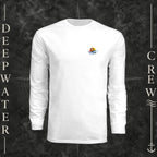 White Deepwater Crew Co. Be Salty, Stay Lit UPF 44+ long-sleeve performance shirt, front view with small cross, sunset, and blue-wave crest with DC logo.