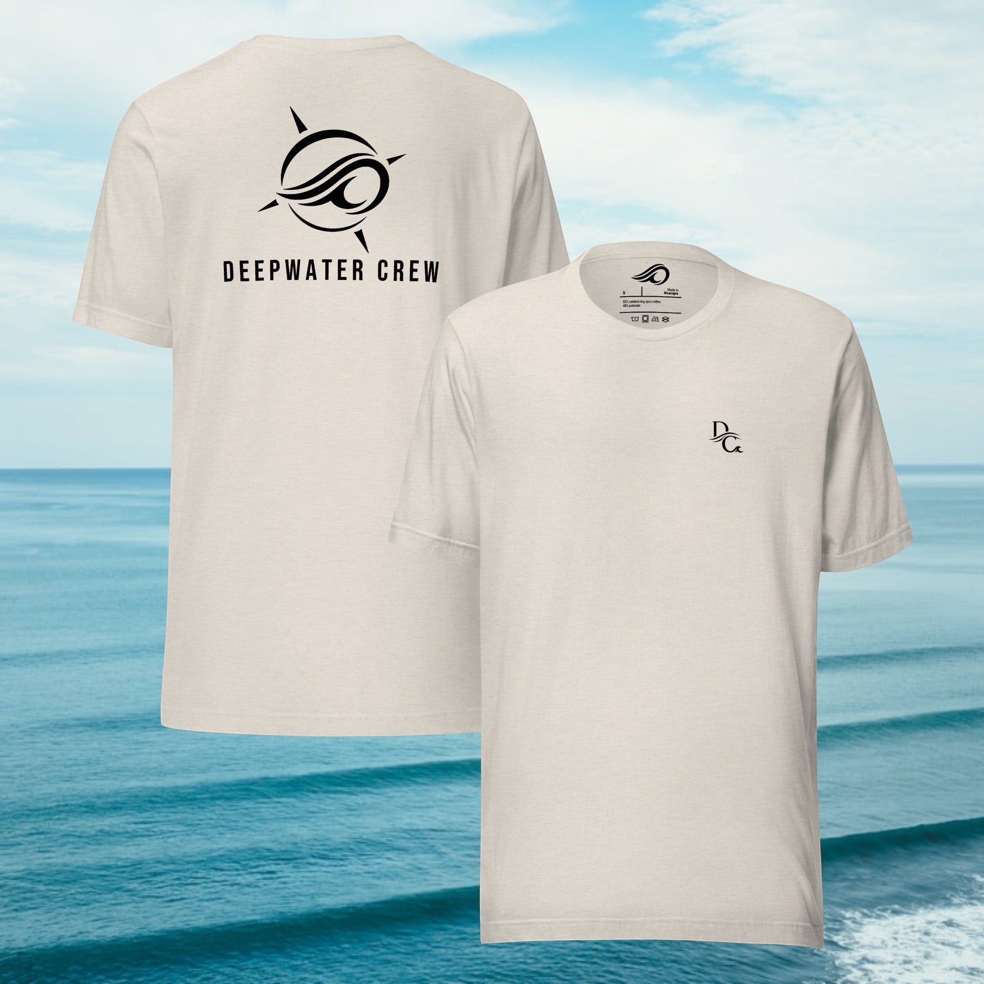 Deepwater Crew Co. beige cotton crew neck t-shirt with small front logo and large back graphic against ocean backdrop