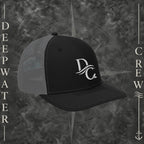 Deepwater Crew Co. black and grey snapback trucker cap with white embroidered wave logo on front panels