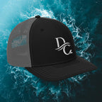Deepwater Crew Co. black and grey snapback trucker cap with white embroidered wave logo on front panels