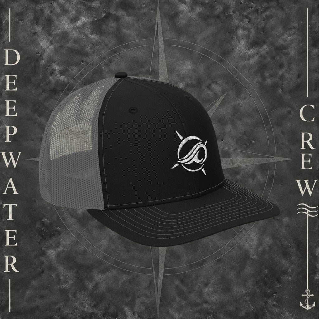Deepwater Crew Co. Horizon coastal trucker hat in black and grey with an embroidered wave-and-compass logo.