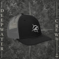 Deepwater Crew Co. Horizon coastal trucker hat in black and grey with an embroidered wave-and-compass logo.