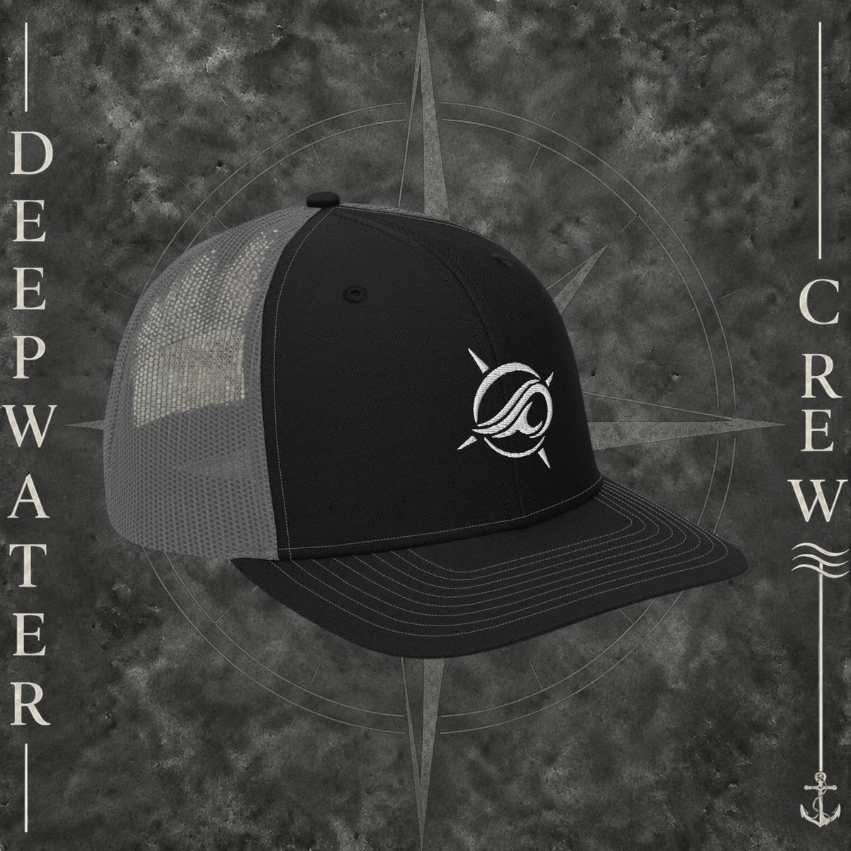 Deepwater Crew Co. Horizon coastal trucker hat in black and grey with an embroidered wave-and-compass logo.