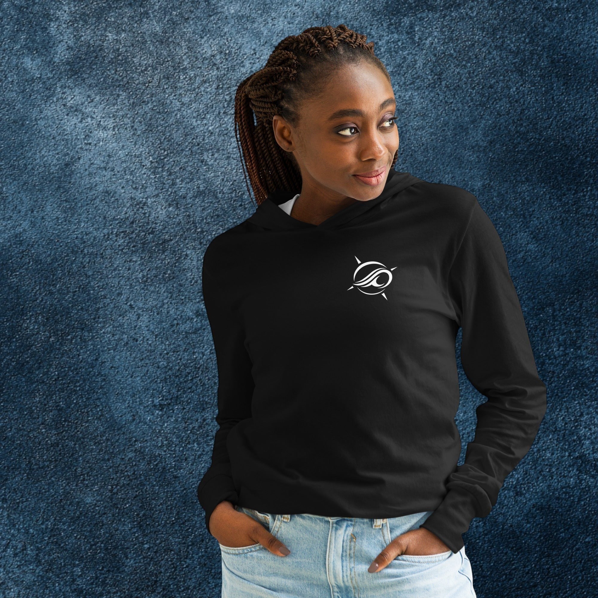 Deepwater Crew Co. black 100% cotton long-sleeve hooded tee with white logo on chest. Model wears jeans.