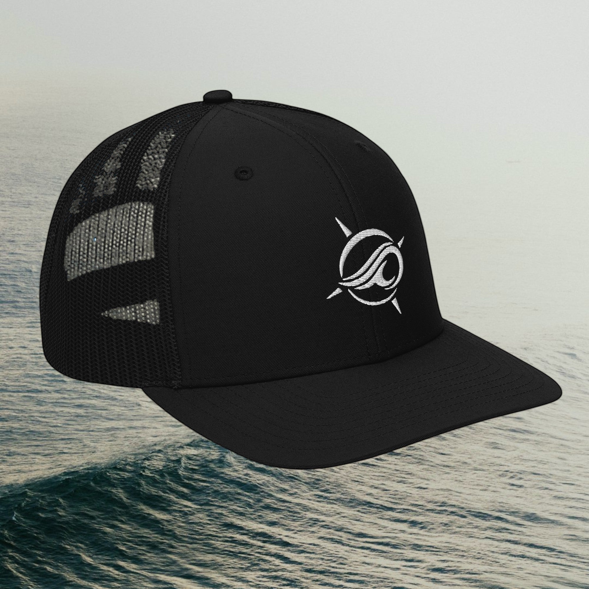 Deepwater Crew Co. black trucker cap with white embroidered wave logo, mesh back, and adjustable snapback closure.