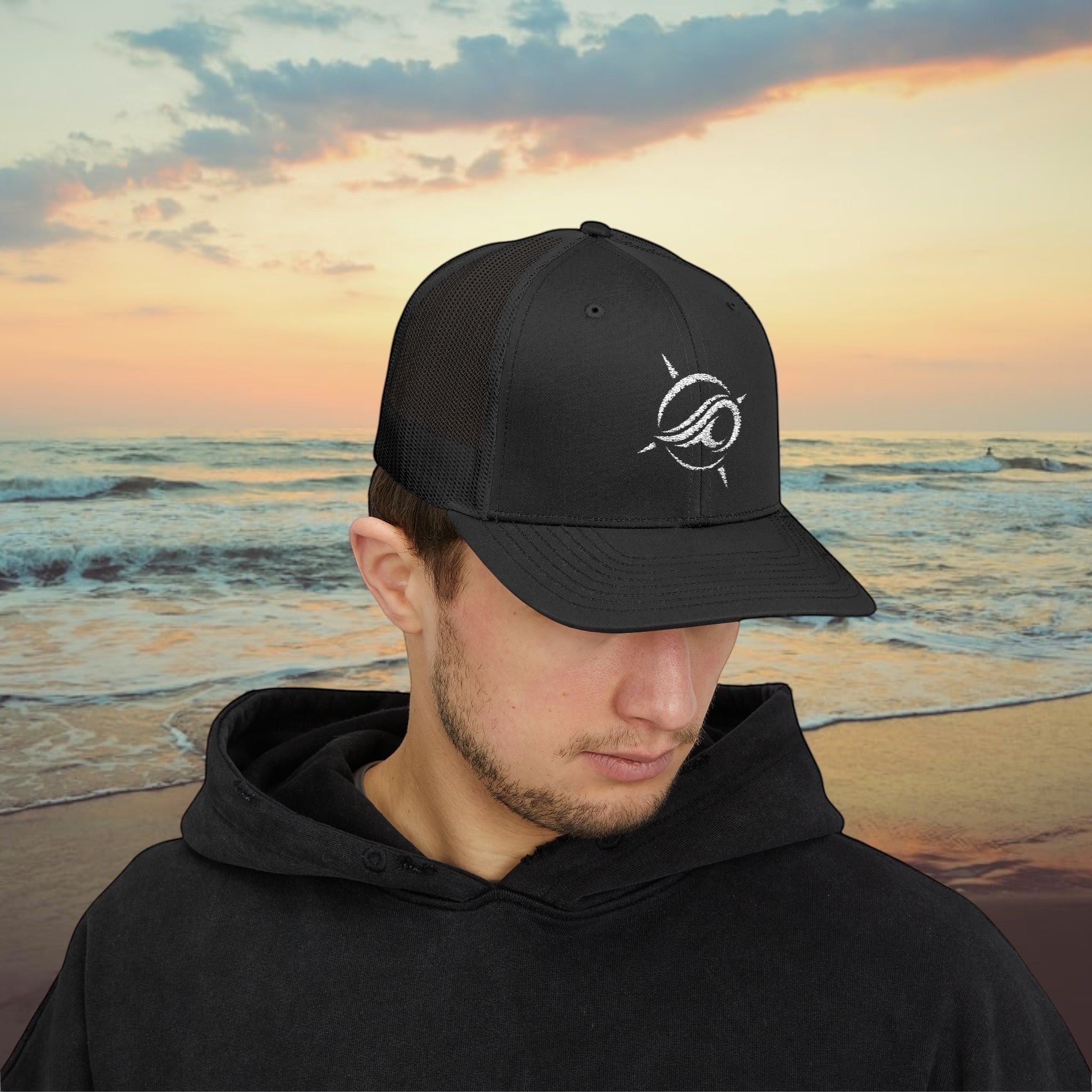 Deepwater Crew Co. black trucker hat with white wave logo, mesh back, and adjustable snapback closure.