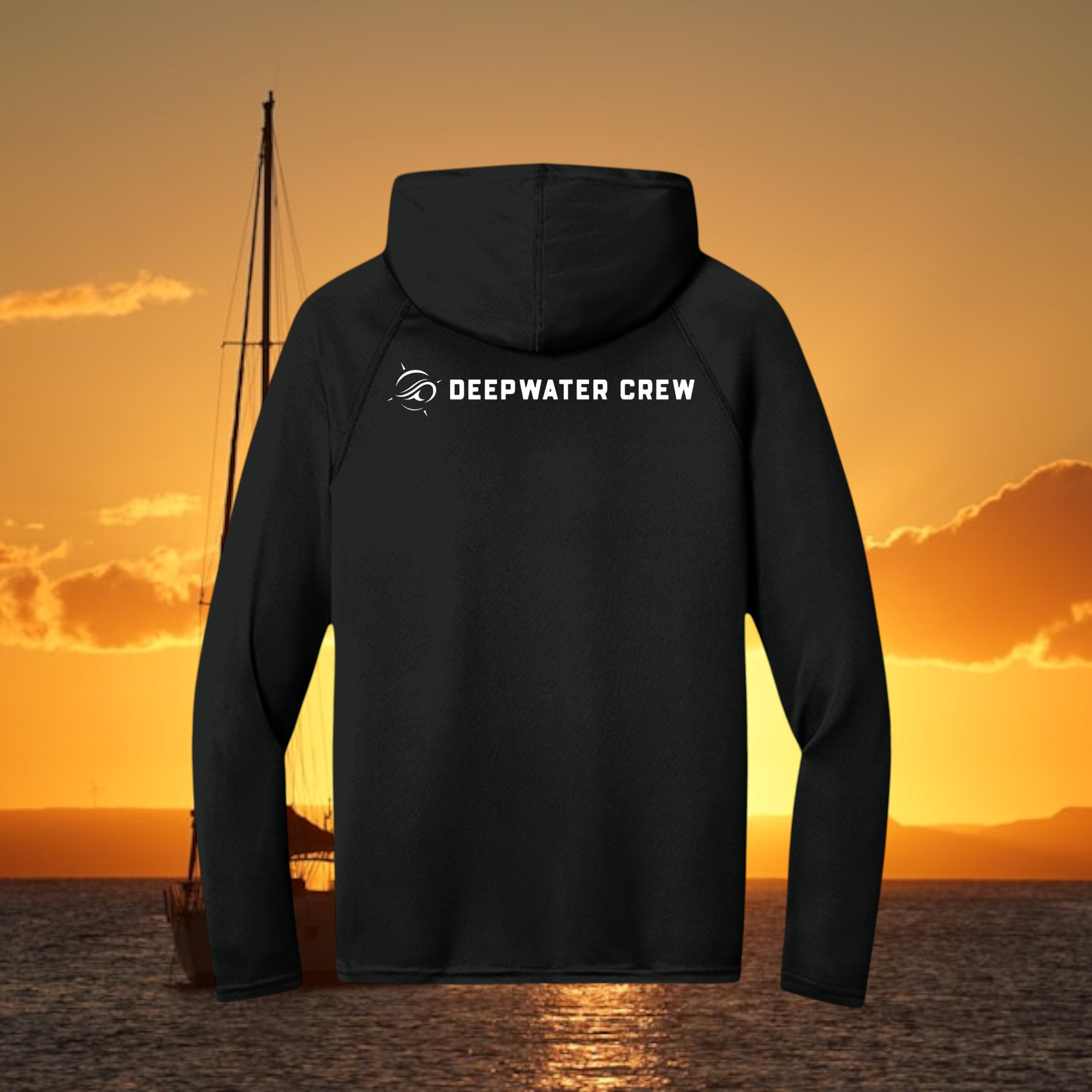 Deepwater Crew Co. black performance UPF hoodie with white logo on back, featuring raglan sleeves and ocean backdrop.