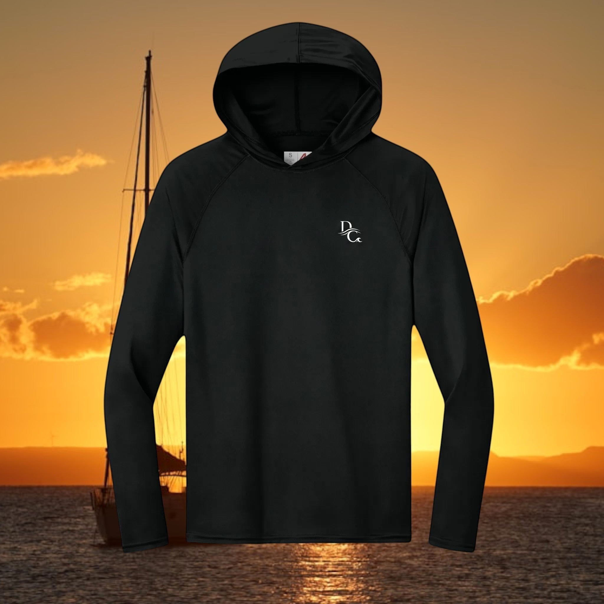 Deepwater Crew Co. black performance UPF hoodie with raglan sleeves and small white logo on chest against ocean wave.