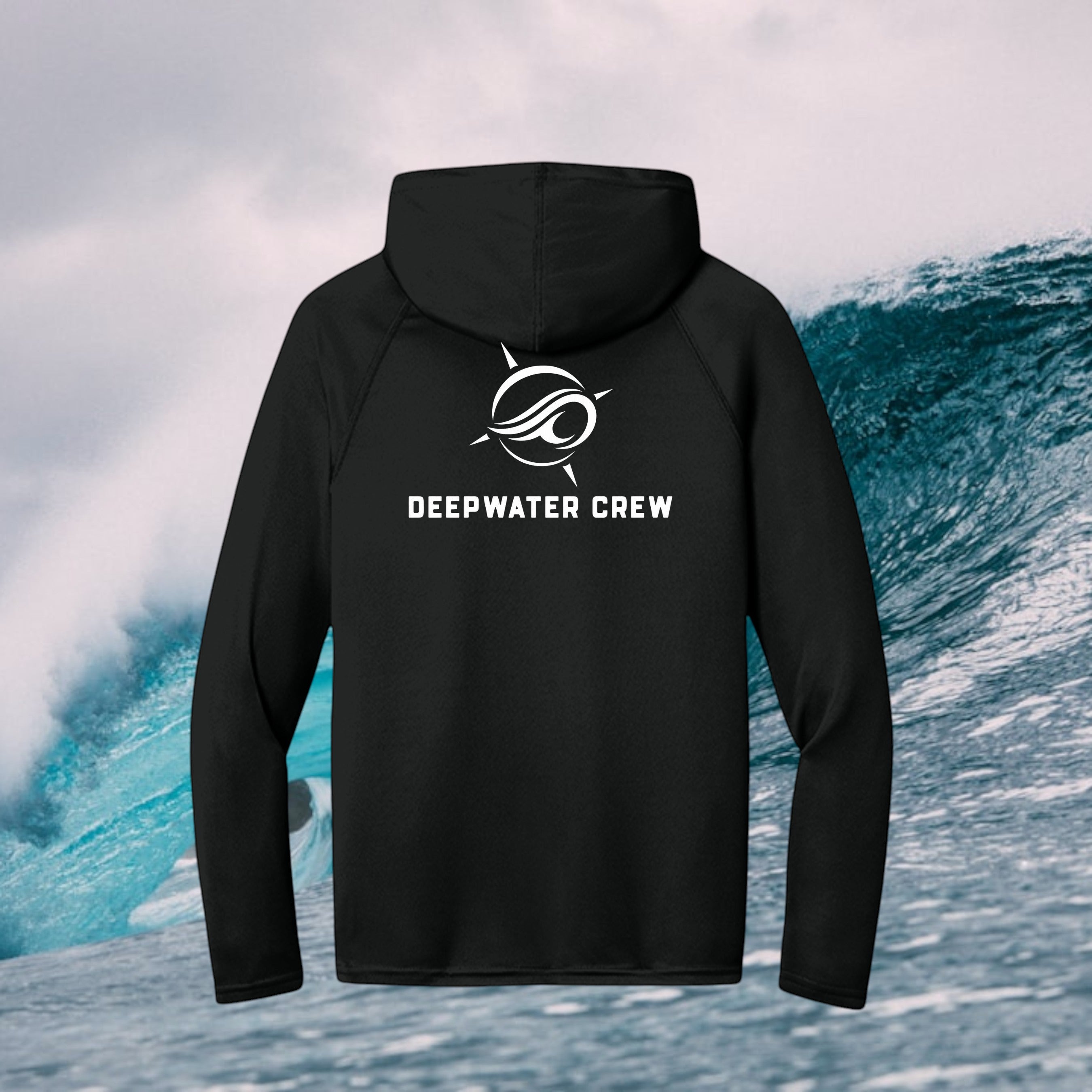 Deepwater Crew Co. black long-sleeve performance UV hoodie with white logo on back, set against an ocean wave background.