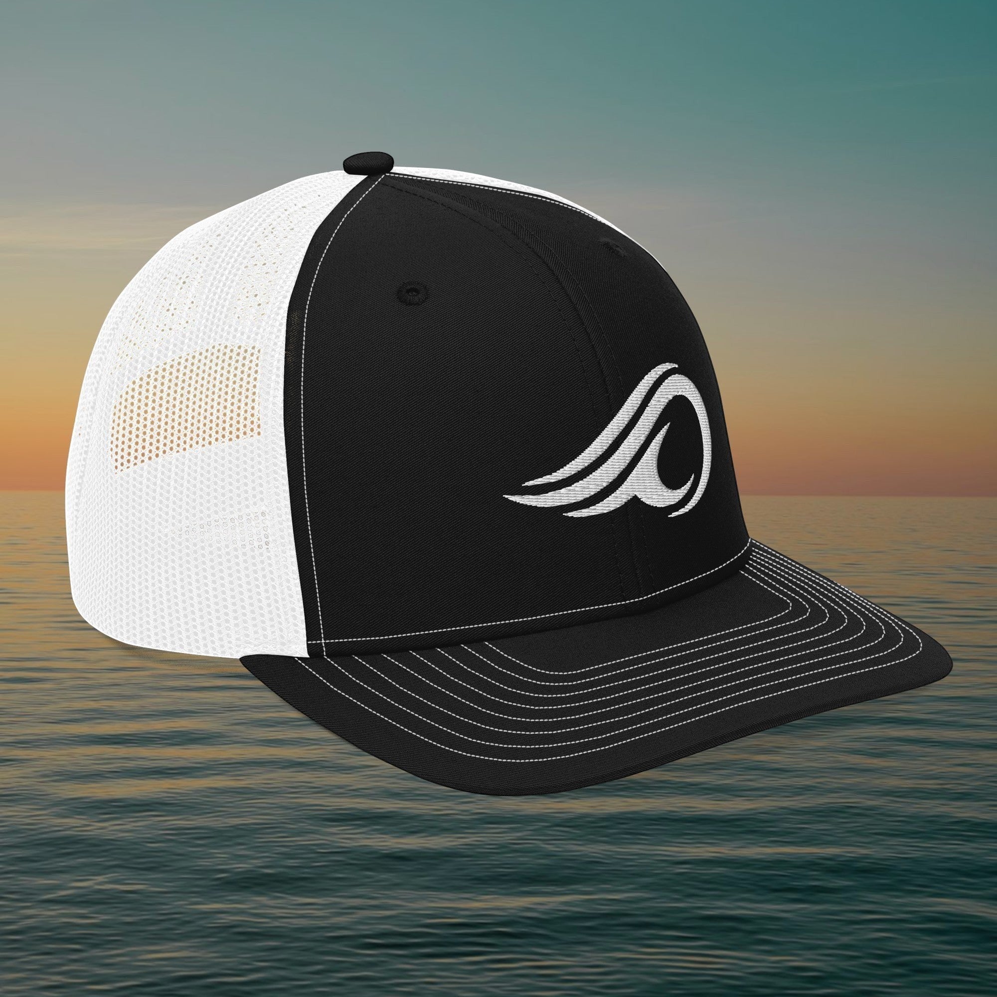 Deepwater Crew Co. black and white snapback trucker cap with embroidered wave logo and breathable mesh back
