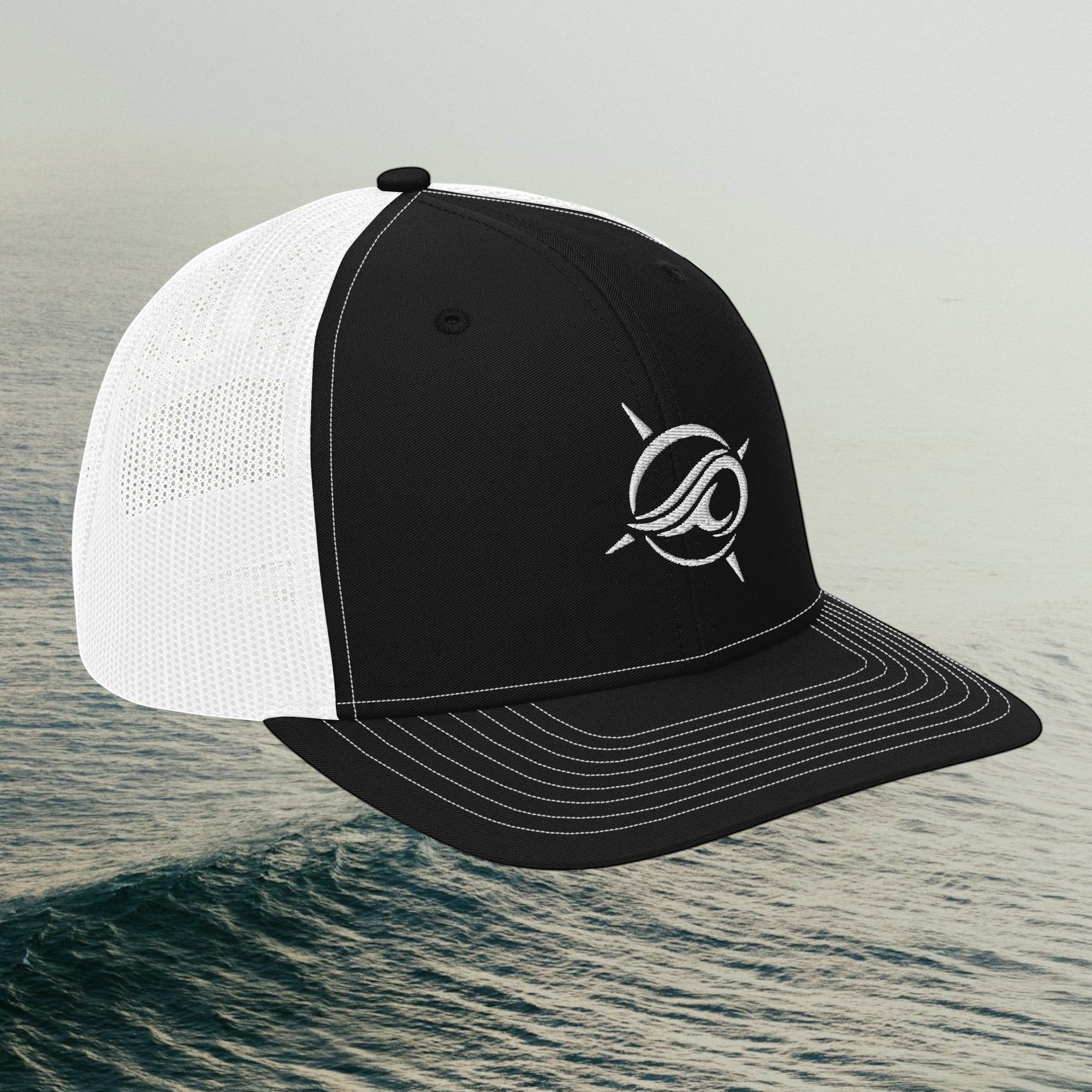 Deepwater Crew Co. black and white trucker cap with embroidered wave logo and breathable mesh back