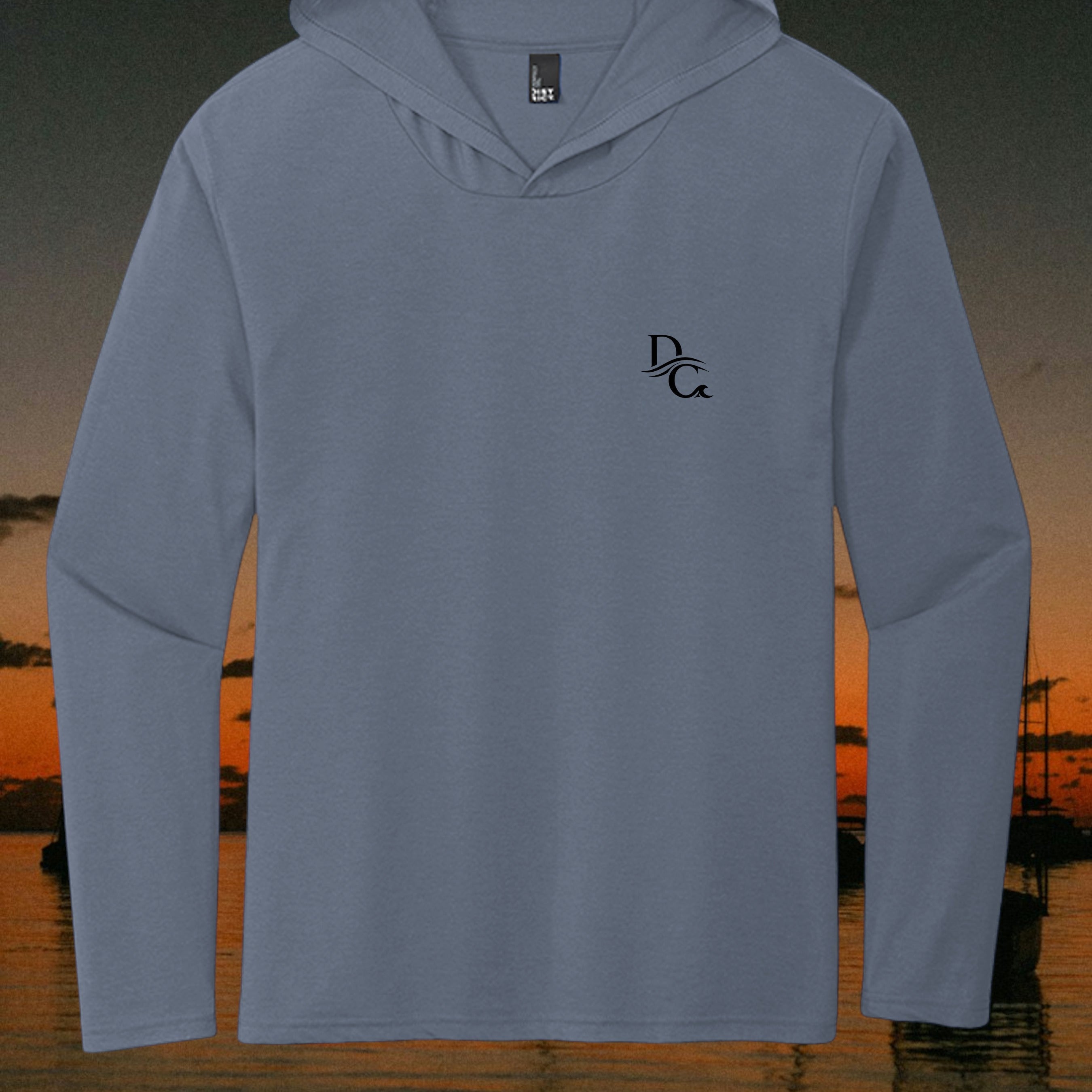 Deepwater Crew Co. blue tri-blend long sleeve hoodie with a small black logo on the chest against a sunset background.