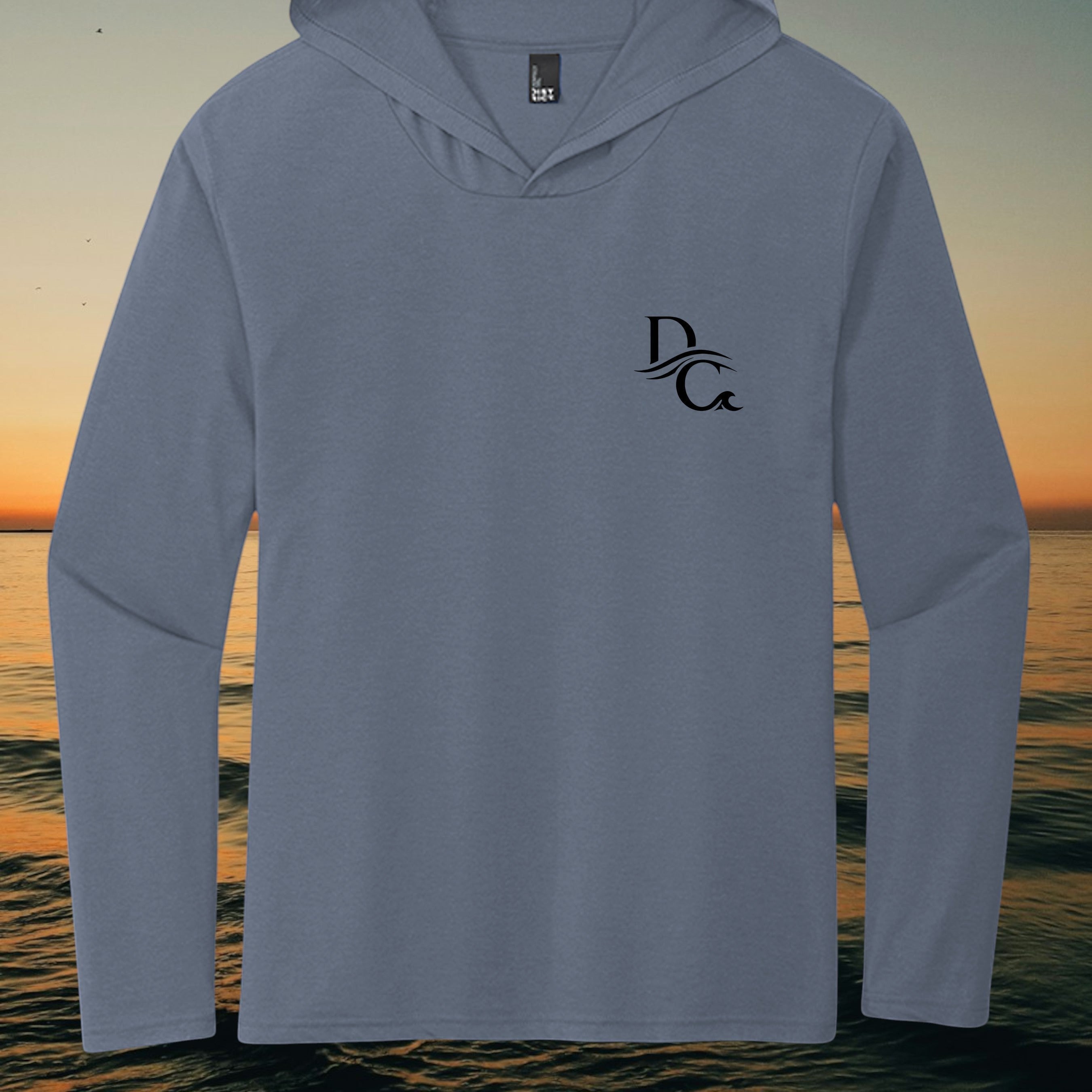 Deepwater Crew Co. blue tri-blend long sleeve hoodie with a black chest logo against a sunset ocean background
