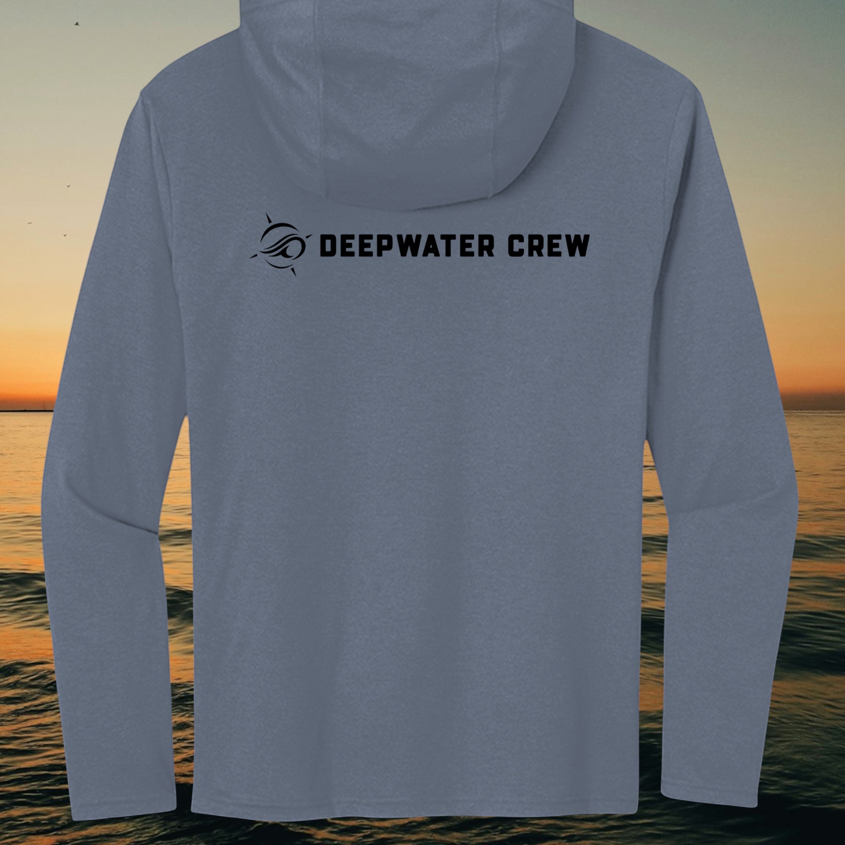 Deepwater Crew Co. blue tri-blend long sleeve hoodie with black logo on back against a sunset ocean background