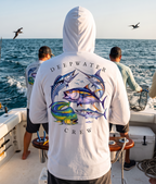 Man wearing a white Deepwater Crew Co. Bluewater Strike UPF 50+ performance hoodie, back view with colorful pelagic game fish collage and Deepwater Crew lettering while offshore fishing on a boat.