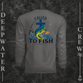 Graphite Deepwater Crew Co. Called to Fish UPF 44+ long-sleeve performance shirt, back view with cross, mahi-mahi, waves, offshore fishing elements, Matthew 4:19, and Called to Fish lettering.