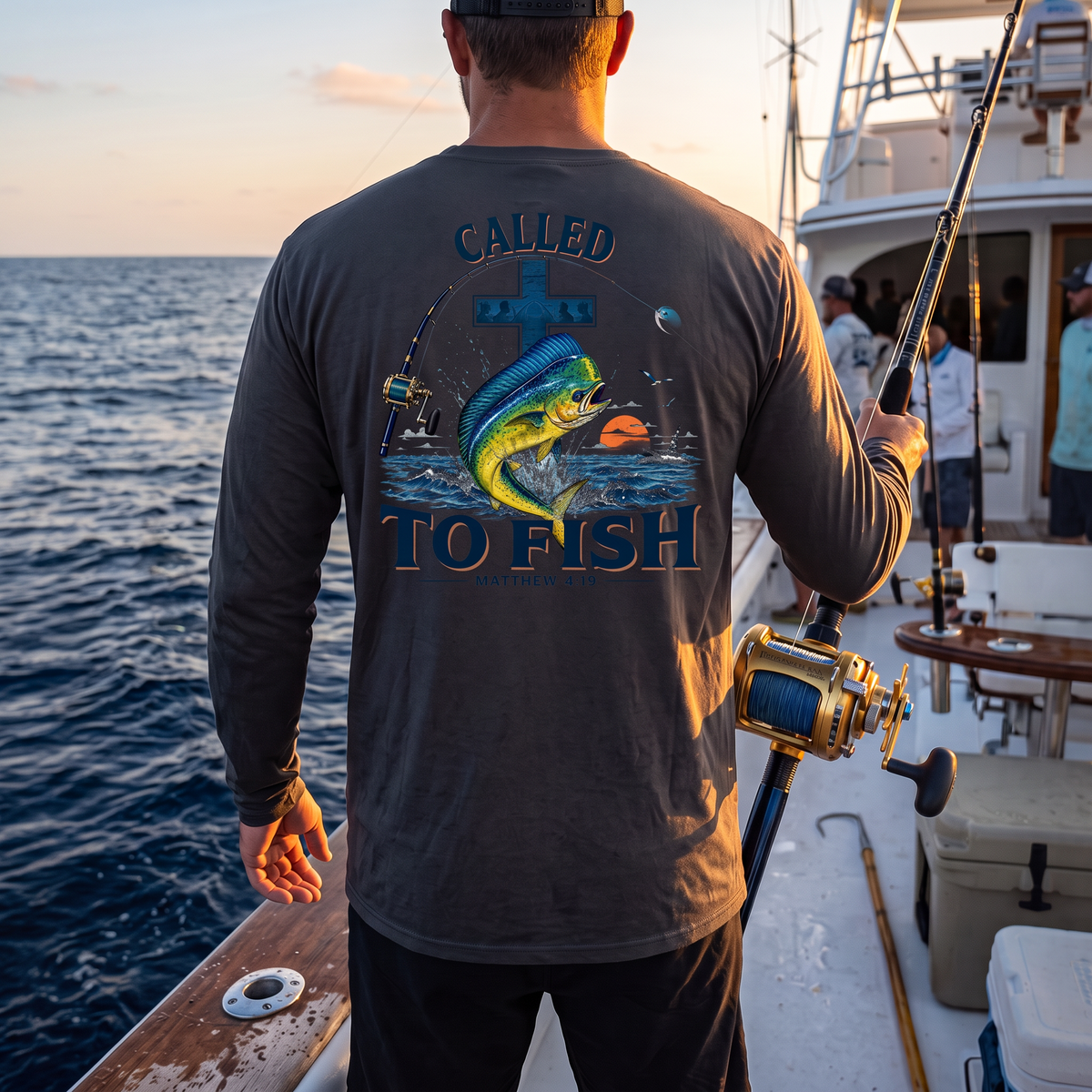 Model wearing a Graphite Deepwater Crew Co. Called to Fish UPF 44+ long-sleeve performance shirt in a lifestyle setting.