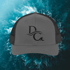 Deepwater Crew Co. charcoal grey trucker hat with black mesh back and embroidered DC wave logo.