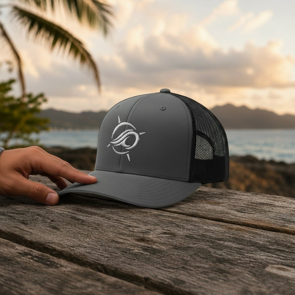 Deepwater Crew Co. charcoal grey trucker hat with white embroidered wave logo and black mesh back.