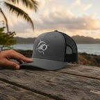 Deepwater Crew Co. charcoal grey trucker hat with white embroidered wave logo and black mesh back.
