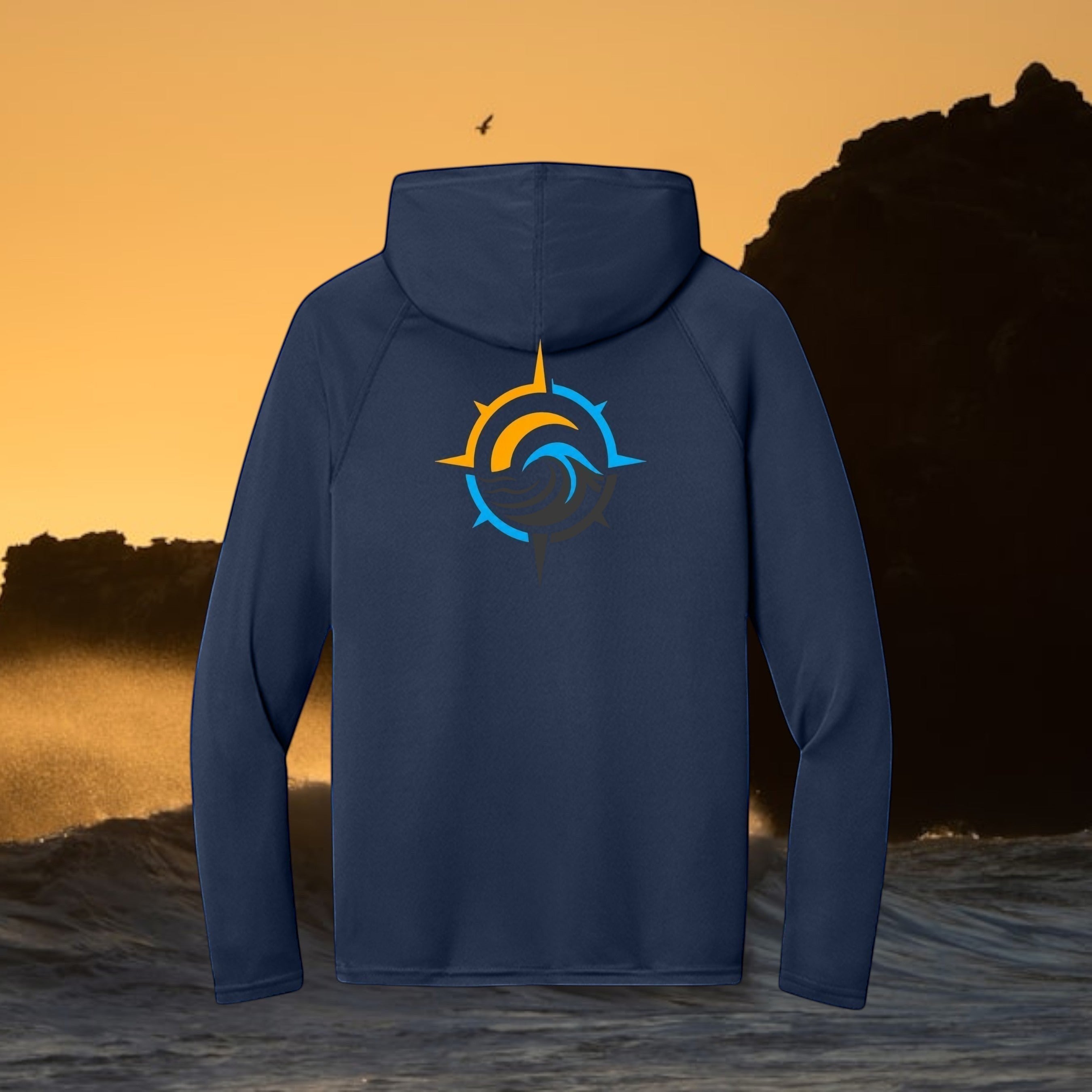 Deepwater Crew Co. dark blue performance UPF hoodie with a compass wave logo on the back against a sunset ocean view.