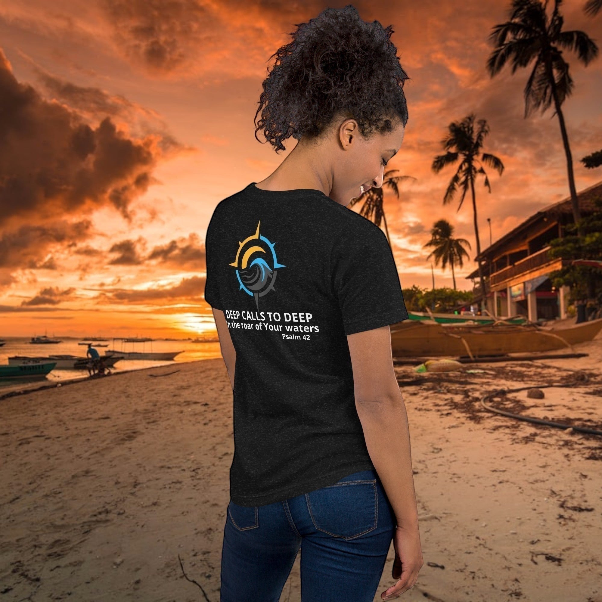 Deepwater Crew Co. dark grey crew neck tee with a compass graphic and text "DEEP CALLS TO DEEP in the roar of Your waters Psalm 42" on the back.