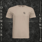 Dust Deepwater Crew Co. Deepwater Nomad crewneck T-shirt, front view with small DC compass crest chest logo.