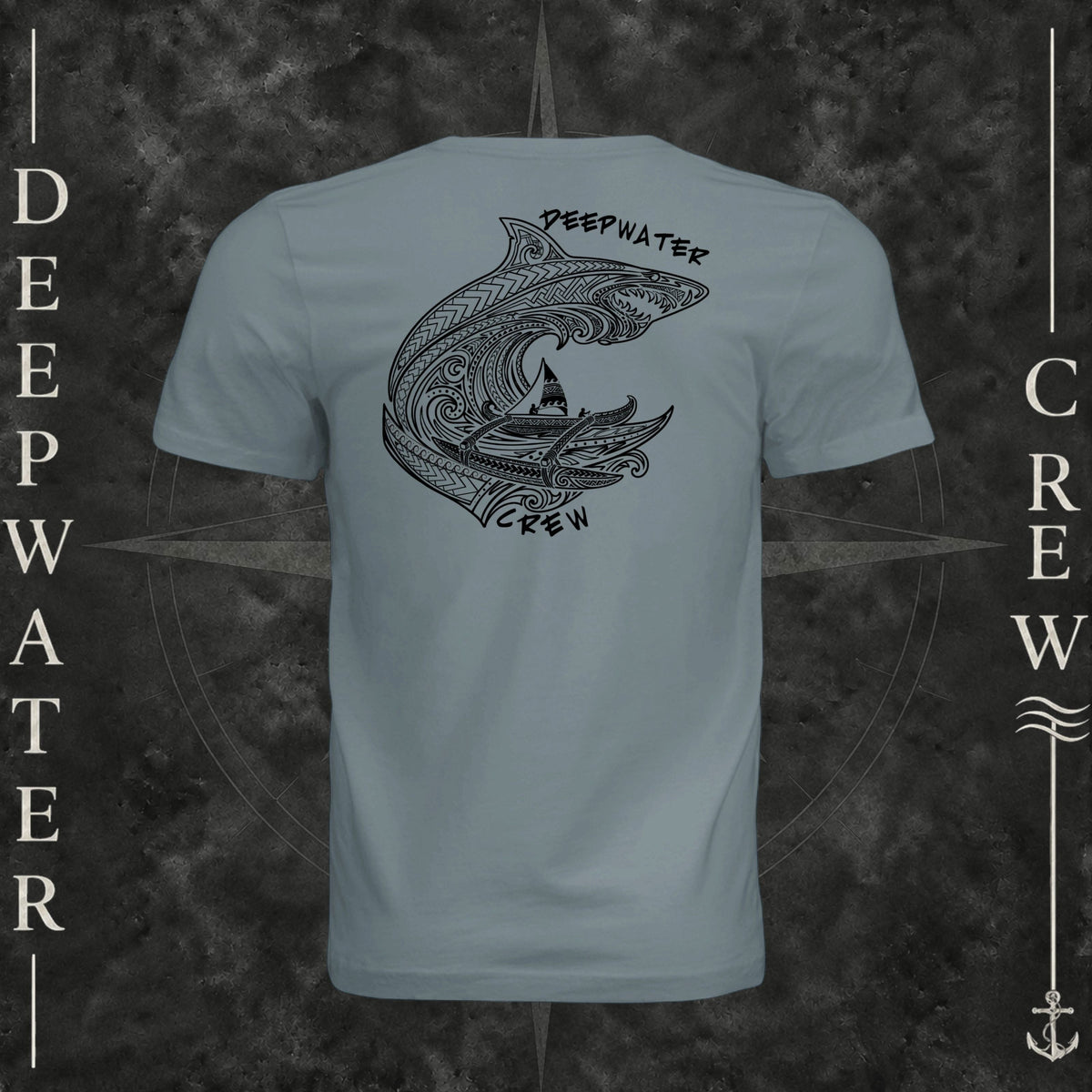 Blue Storm Deepwater Crew Co. Deepwater Passage crewneck T-shirt, back view with large patterned shark, outrigger canoe and ocean wave graphic with Deepwater Crew lettering.