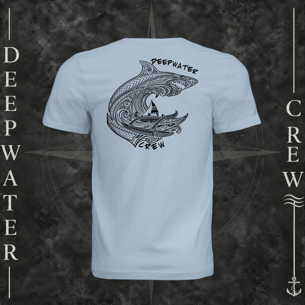 Light Blue Deepwater Crew Co. Deepwater Passage crewneck T-shirt, back view with large patterned shark, outrigger canoe and ocean wave graphic with Deepwater Crew lettering.