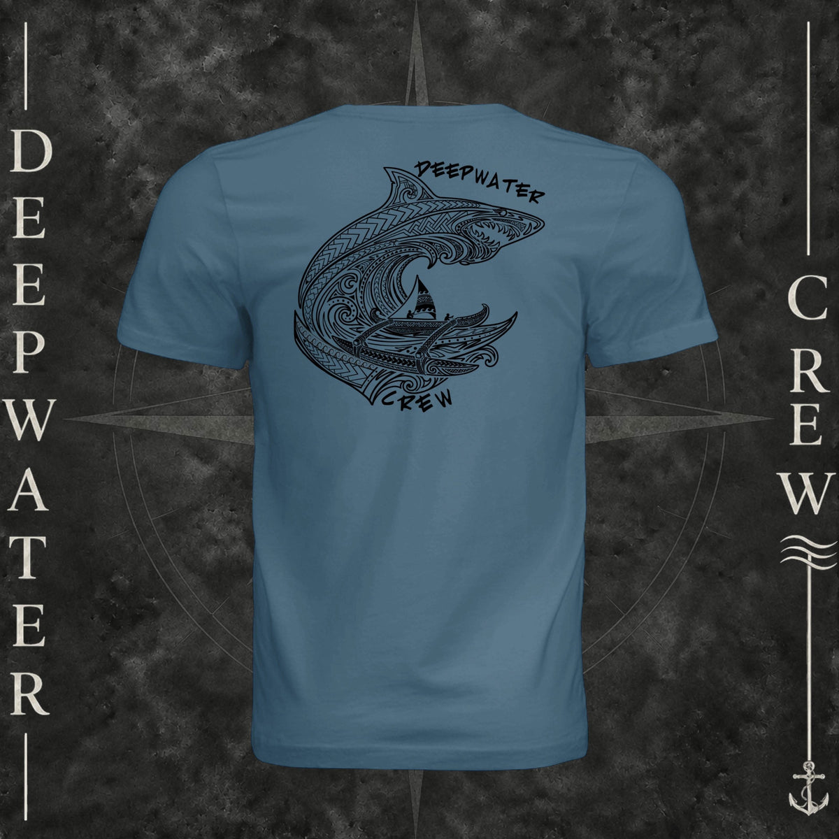 Steel Blue Deepwater Crew Co. Deepwater Passage crewneck T-shirt, back view with large patterned shark, outrigger canoe and ocean wave graphic with Deepwater Crew lettering.