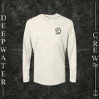 Sand Deepwater Crew Co. Deepwater Passage UPF 50+ performance hoodie, front view with small DC wave crest chest logo.
