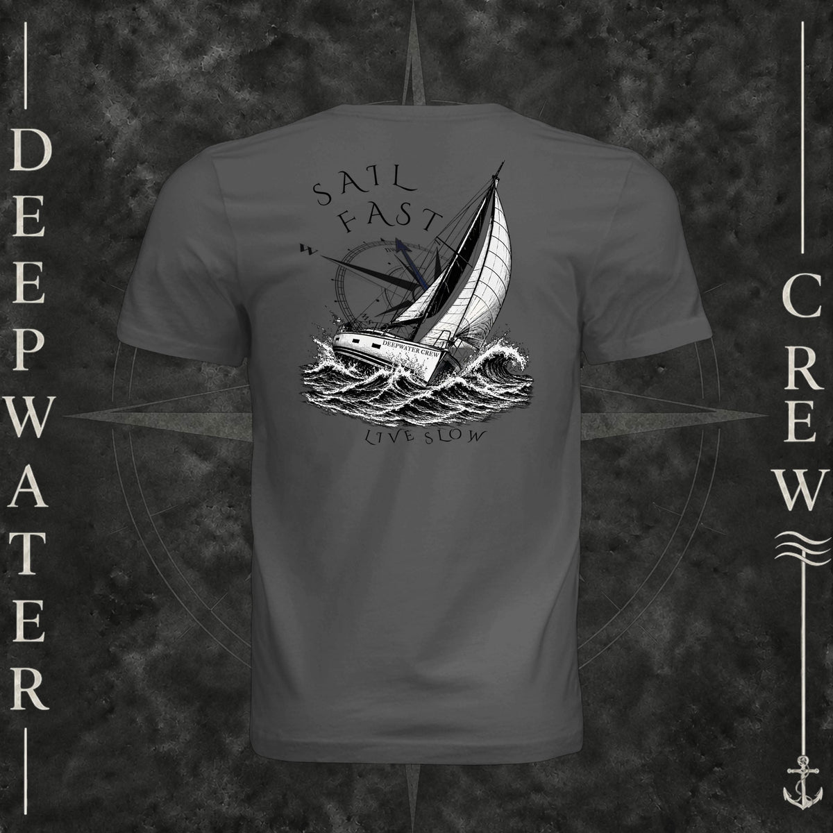 Asphalt Deepwater Crew Co. Fast & Free crewneck T-shirt, back view with large sailboat, ocean wave and compass graphic featuring “Sail Fast Live Slow” lettering.
