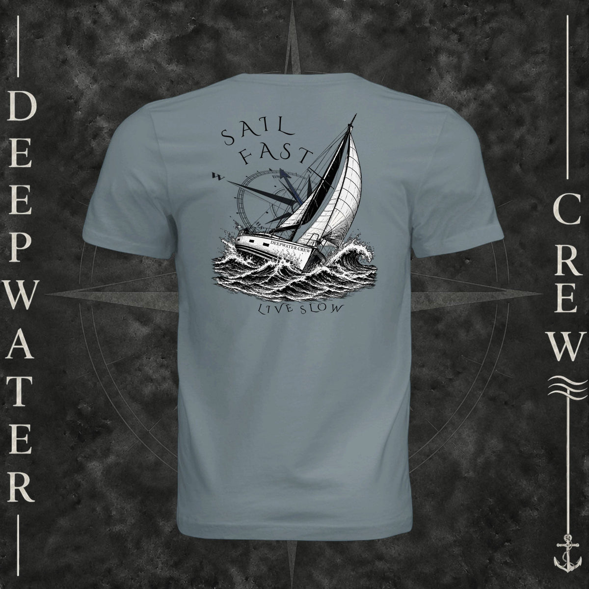 Blue Storm Deepwater Crew Co. Fast & Free crewneck T-shirt, back view with large sailboat, ocean wave and compass graphic featuring “Sail Fast Live Slow” lettering.