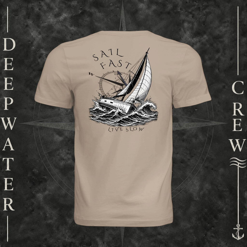 Dust Deepwater Crew Co. Fast & Free crewneck T-shirt, back view with large sailboat, ocean wave and compass graphic featuring “Sail Fast Live Slow” lettering.