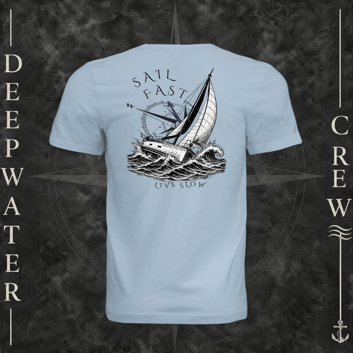 Light Blue Deepwater Crew Co. Fast & Free crewneck T-shirt, back view with large sailboat, ocean wave and compass graphic featuring “Sail Fast Live Slow” lettering.